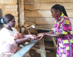 At the final station, a woman receives cash