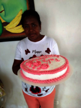 Cruz with one of the cakes she sales