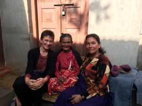 Tricia with patient and family during a home visit