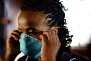 Nurse treating TB patient in "The Lucky Specials"