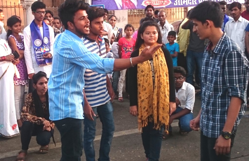 Youths putting up play on Redefining Masculinity