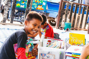 This boy loves reading to younger friends