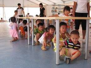 Playing under a table with friends