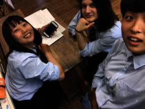 Students using their cell phone to post comments