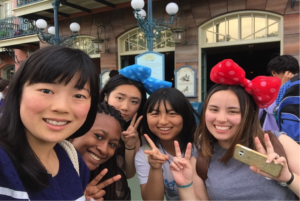 Say "cheese" and make a peace sign!