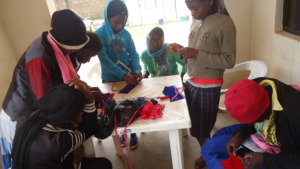 Girls learning skills at the summit