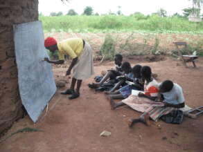 Children learning under tree shade