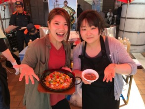 Our staff trying to promote our main menu "Paella"