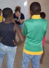 The children learn an auditory game with visitors