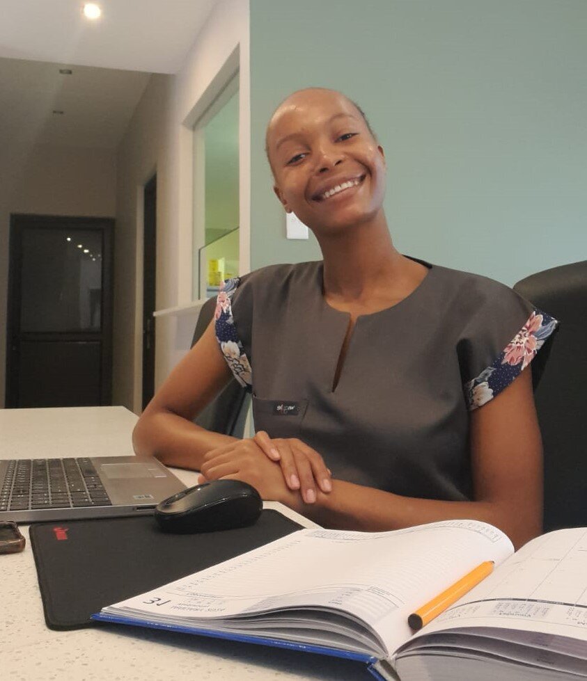 Grace at the receptionist desk.