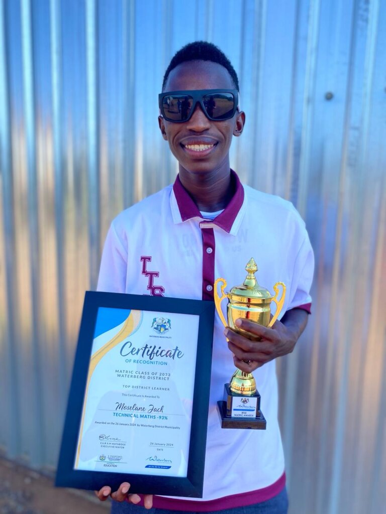 Jack with his certificate and trophy.