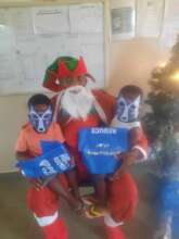 Santa Claus handing out gifts on Christmas day