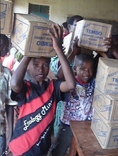 Students receiving school materials in Rwanda