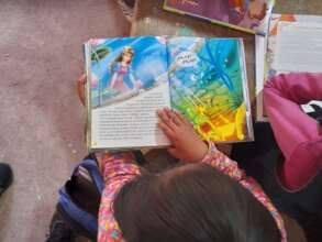 One of the kids reading a new book