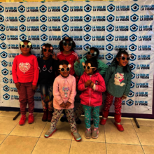 Happy kids getting their eyes tested