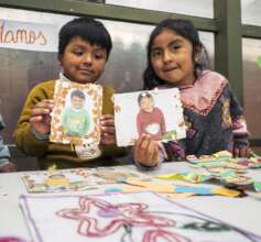 Two students proudly displaying the custom picture