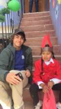 Wearing Christmas hats with our volunteer!