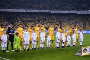 Children with the football stars