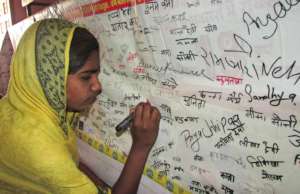 The woman is raising the voice with signature