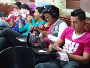 Young people are reading the educational material