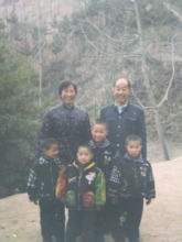 Lun, right, with his grandparents & three brothers