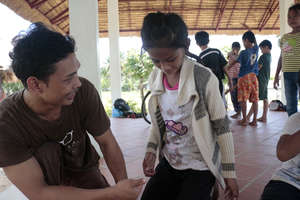 Socheat helps a student develop his confidence