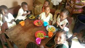 The nursery students enjoying their meal