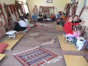 Girls weaving carpet