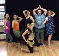 Volunteer Peter Taghe belly dances for Bolivia
