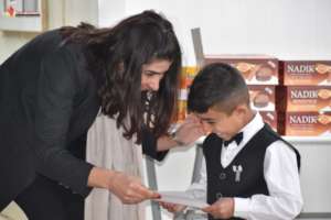 Boy receiving certificate