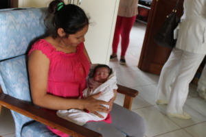 Patricia and her baby resting at Casa Maurita