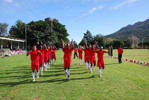 Academy warming up in front of families and guests.