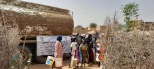 Families fill up jerrycans with water