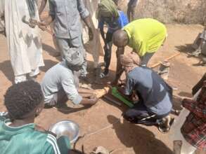 Handpump being repaired in Gawir Village