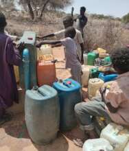 Children collect clean water in their jerrycans