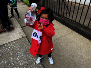 A little ISB student proudly shows her full bottle