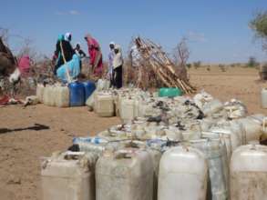 Queueing for water after the long walk