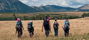 Dr. Eisenberg leads volunteers to research site