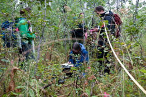 Dr. Eisenberg records data during a transect track