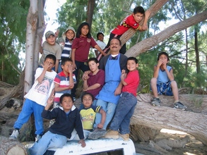 Raul Lutisuc's instructor and the kids