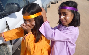 Two little tohono girls in traditional dresses