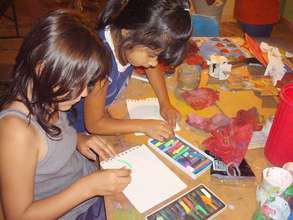 Two girls experiment with pastel technique