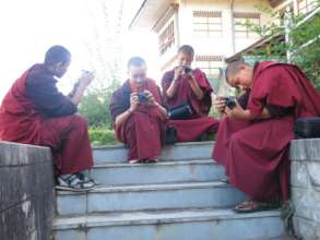 Nuns trying out their cameras during the training
