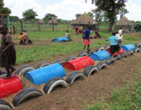 Nursery students on train - fencing in background