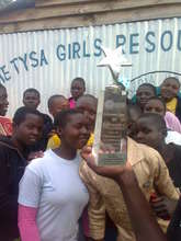Girls admire the award