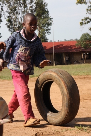 Master Simon riding an old tyre