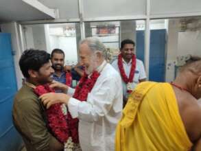 Garlanding Vishwa after Shelter puja.