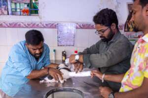 Dr. Mahesh with clinic patient - poor baby,