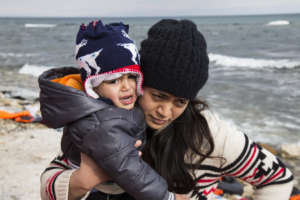 A woman and child landing in Lesvos