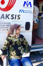 Muna outside of a mobile medical unit